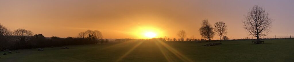 Photo of sun setting over our farm